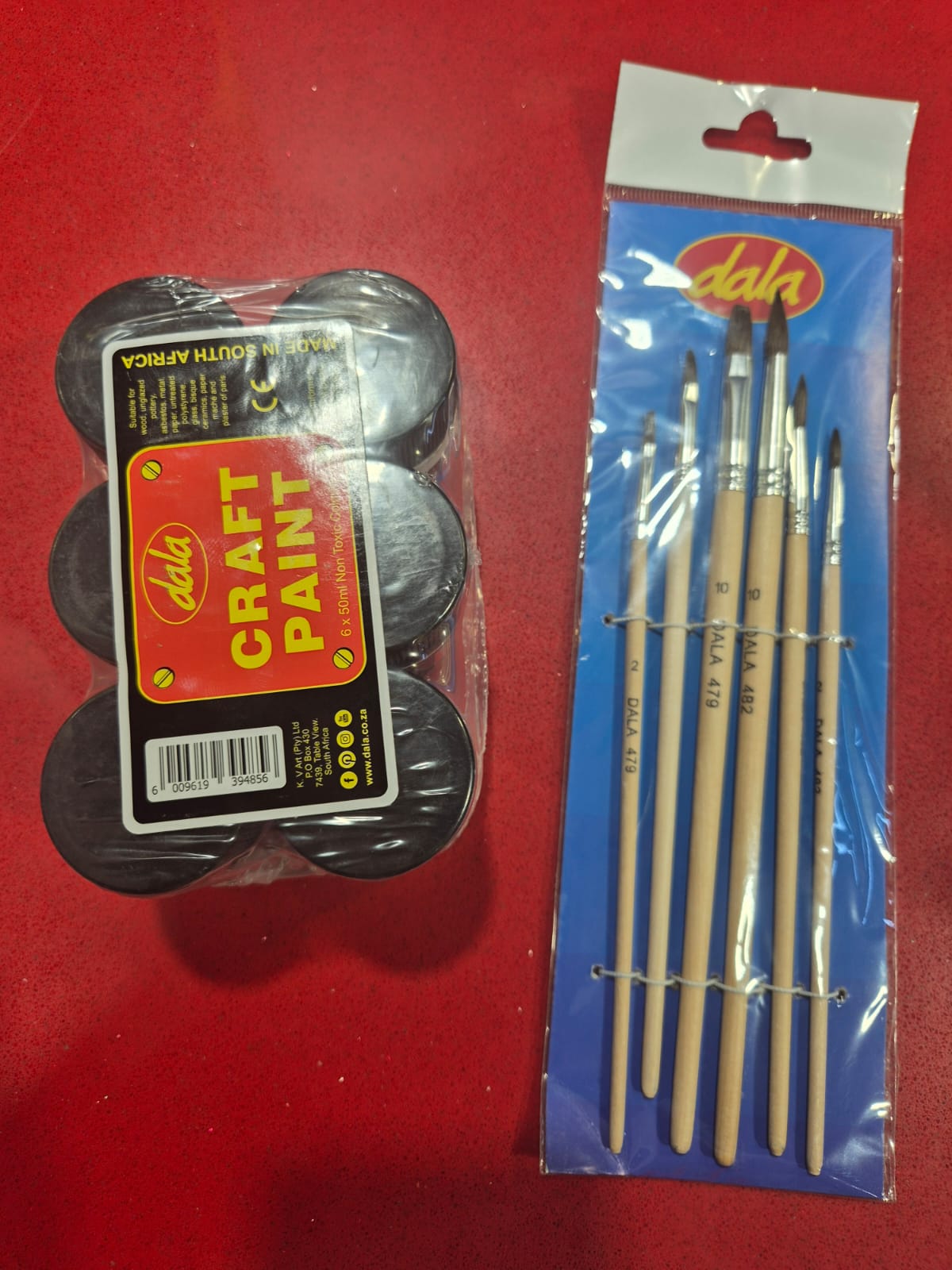 Craft paint pots and a paintbrush set bought for the CloneMini DIY paint kit prototype